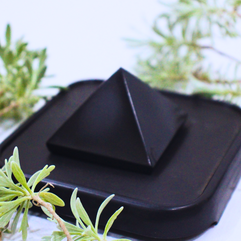 Black Tourmaline Pyramid Black Tourmaline crystal pyramid with polished surface and pointed tip for protection and grounding.
