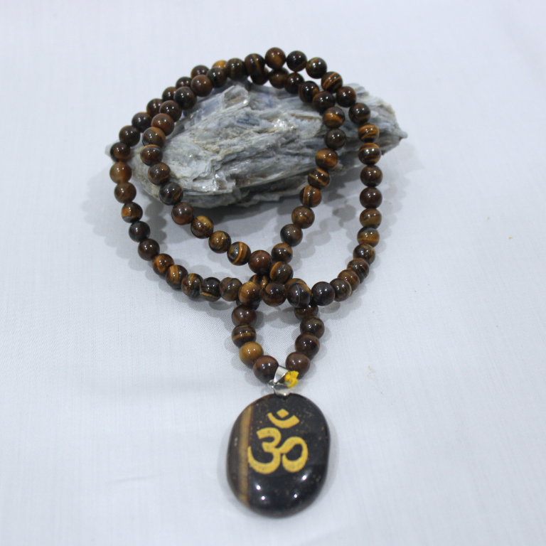Tiger Eye Beads Necklace With Om Pendant Tiger Eye beads necklace with Om pendant for confidence and protection.