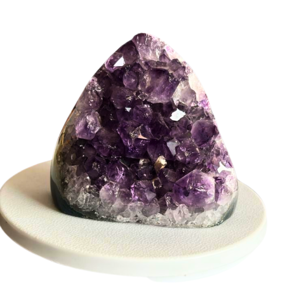 Natural amethyst crystal cluster with multiple purple points and raw texture.
