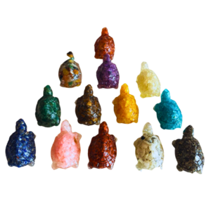 Crystal orgone tortoise made with resin, natural crystals, and metal filings in decorative design.