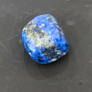 Lapis Lazuli tumble crystal used for communication, wisdom, and spiritual awareness.