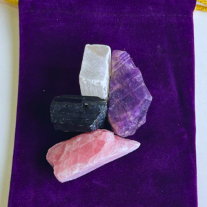 Natural raw crystal set featuring Rose Quartz, Amethyst, Black Tourmaline, and Selenite arranged together for love, emotional healing, peace, protection, grounding, and energy purification.