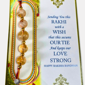 Handcrafted Citrine & Golden Pyrite Rakhi featuring natural Citrine and Golden Pyrite crystals, symbolizing prosperity, abundance, confidence, success, and positive energy.