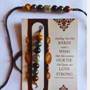 Handcrafted Protection Rakhi featuring Black Obsidian, Tiger Eye, and Hematite crystals to symbolize protection, grounding, confidence, emotional balance, and positive energy.