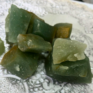 Natural Raw Green Aventurine crystal with an unpolished finish, valued for luck, growth, confidence, positivity, emotional balance, and personal development.