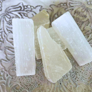Natural Raw Selenite crystal with an unpolished finish, valued for energy cleansing, purification, peace, mental clarity, and spiritual practices.