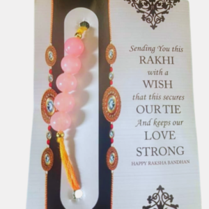 Handcrafted Rose Quartz Rakhi featuring a natural Rose Quartz gemstone, symbolizing love, compassion, harmony, emotional balance, and positive relationships.