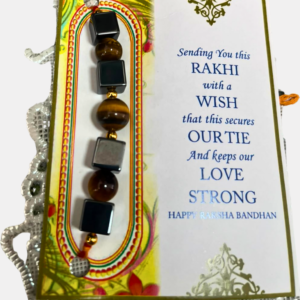 Handcrafted Tiger Eye & Hematite Rakhi featuring natural Tiger Eye and Hematite crystals, symbolizing confidence, strength, grounding, emotional balance, and positive energy.